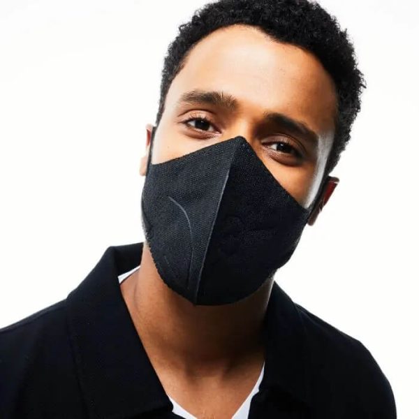 Young Man wearing Airpop Light SE Reusable Face Mask in Black
